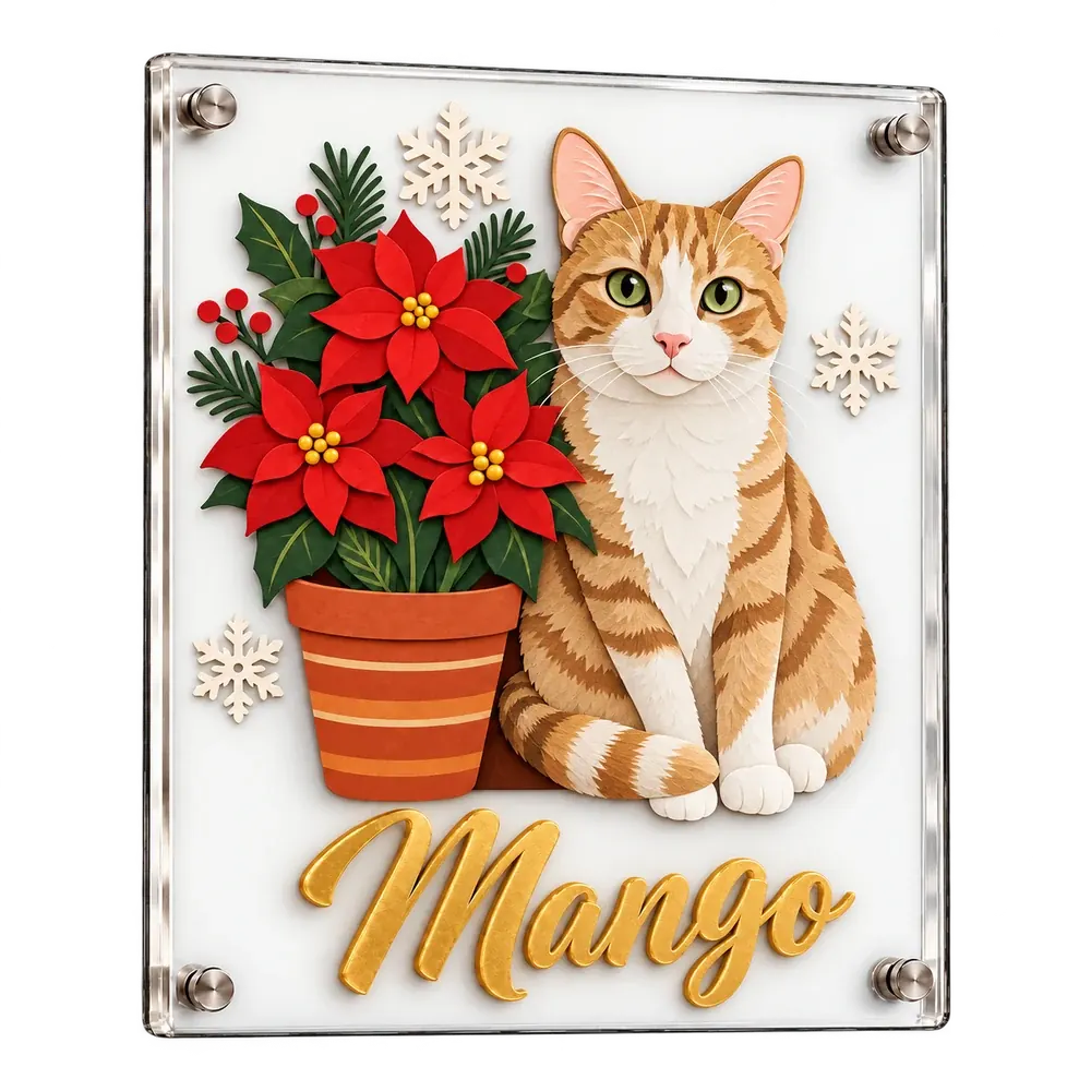 A clear acrylic plaque with a ginger-and-white cat built up in layers of cut glass, and Mango in raised gold script
