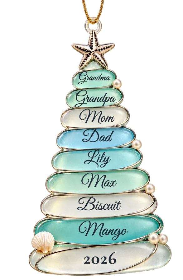 A little tree of eight frosted sea-glass pebbles wrapped in silver wire, a silver starfish on top, the names Grandma, Grandpa, Mom, Dad, Lily, Max, Biscuit and Mango, and 2026 on the base