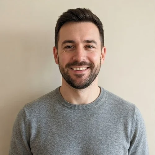 Sample photo: a smiling bearded man in a grey jumper